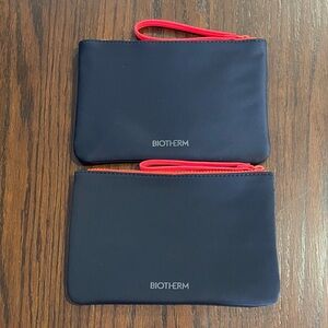 2/$10 Biotherm cosmetic wristlets bags-navy color
